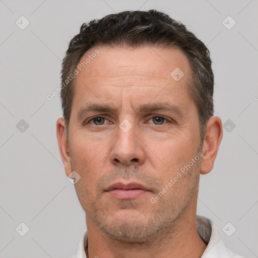 Neutral white adult male with short  brown hair and brown eyes