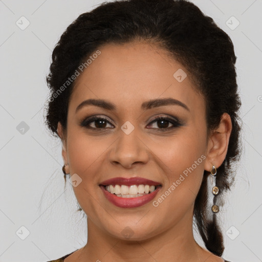 Joyful latino young-adult female with medium  brown hair and brown eyes