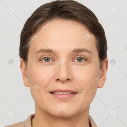 Joyful white young-adult female with short  brown hair and grey eyes