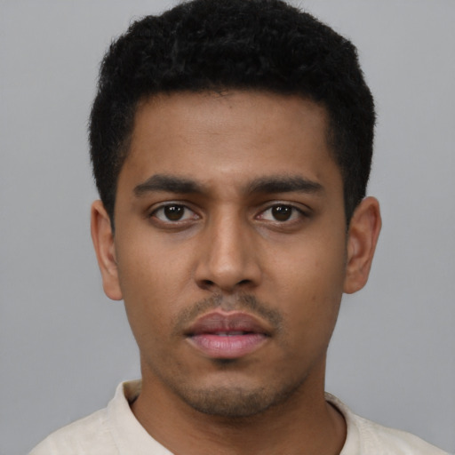 Neutral latino young-adult male with short  black hair and brown eyes