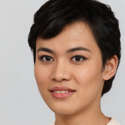 Joyful asian young-adult female with short  brown hair and brown eyes