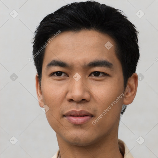 Joyful asian young-adult male with short  black hair and brown eyes