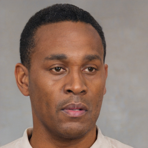 Neutral black young-adult male with short  brown hair and brown eyes