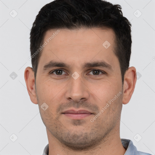 Joyful white young-adult male with short  brown hair and brown eyes