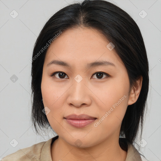 Joyful asian young-adult female with medium  brown hair and brown eyes