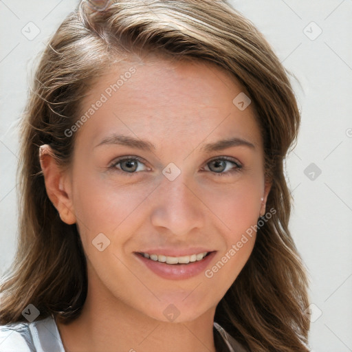 Joyful white young-adult female with long  brown hair and blue eyes