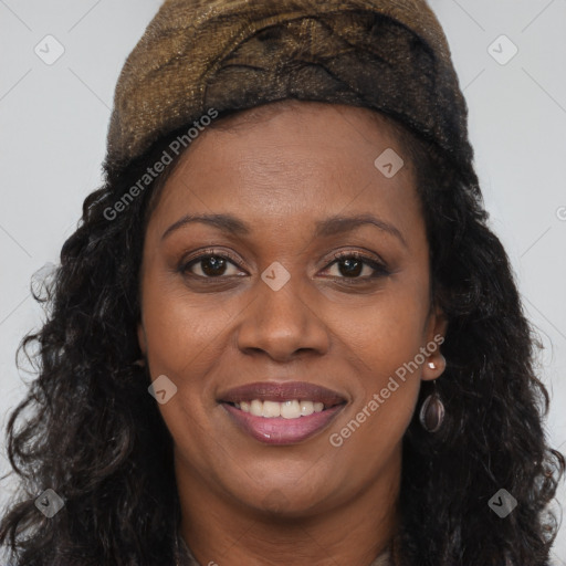 Joyful black young-adult female with long  brown hair and brown eyes