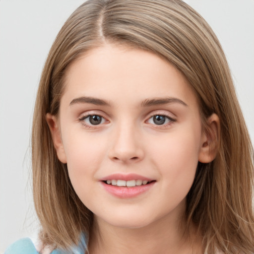 Joyful white child female with medium  brown hair and grey eyes