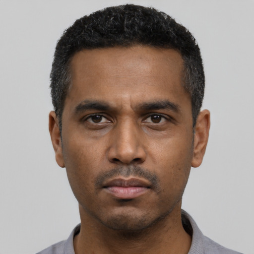 Neutral black young-adult male with short  black hair and brown eyes
