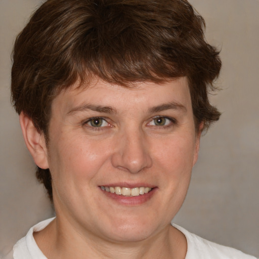 Joyful white adult male with medium  brown hair and brown eyes