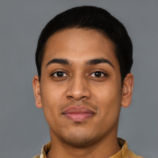 Joyful latino young-adult male with short  brown hair and brown eyes