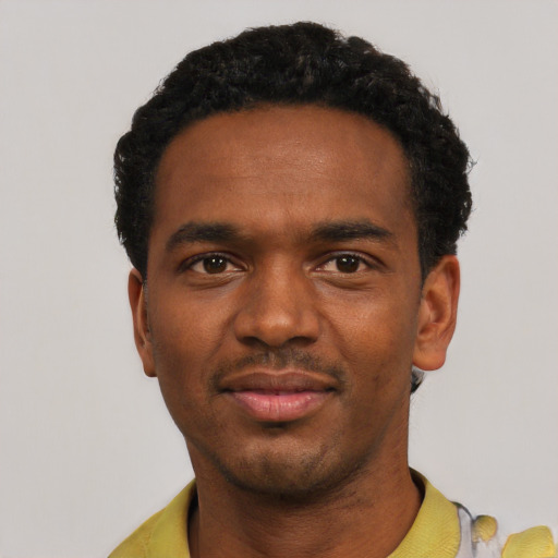 Neutral black young-adult male with short  black hair and brown eyes