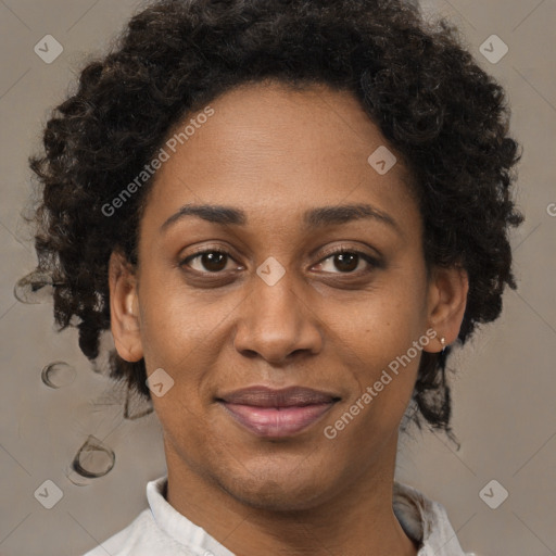 Joyful black adult female with short  brown hair and brown eyes