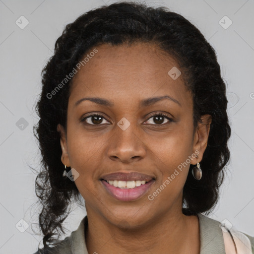 Joyful black young-adult female with long  brown hair and brown eyes