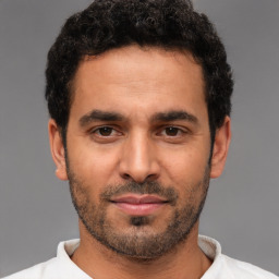 Neutral white young-adult male with short  black hair and brown eyes