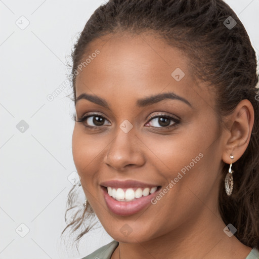 Joyful latino young-adult female with long  brown hair and brown eyes