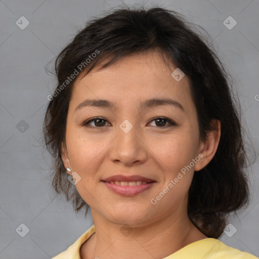 Joyful asian young-adult female with medium  brown hair and brown eyes