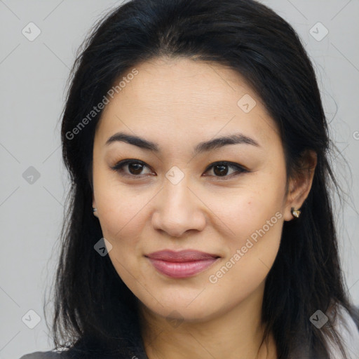 Joyful asian young-adult female with long  brown hair and brown eyes