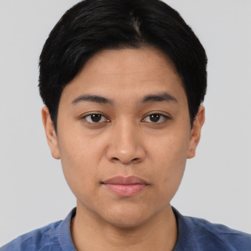 Joyful asian young-adult female with short  black hair and brown eyes
