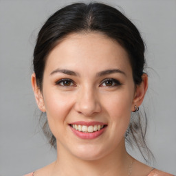 Joyful white young-adult female with medium  brown hair and brown eyes