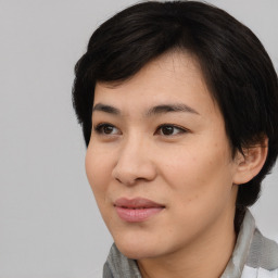 Joyful asian young-adult female with medium  black hair and brown eyes