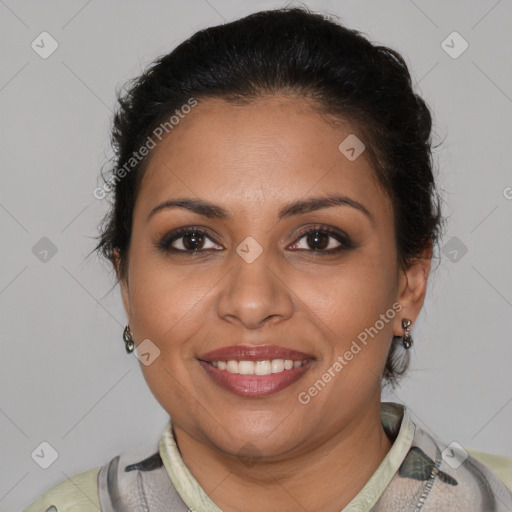 Joyful latino adult female with short  brown hair and brown eyes