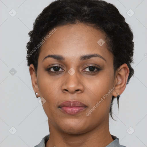 Joyful black adult female with short  black hair and brown eyes