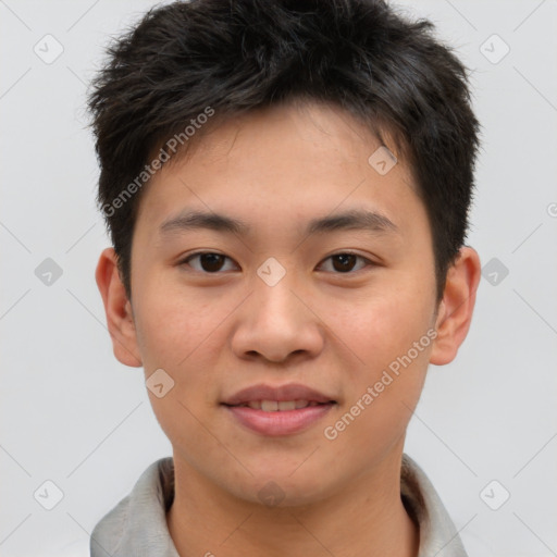 Joyful asian young-adult male with short  brown hair and brown eyes