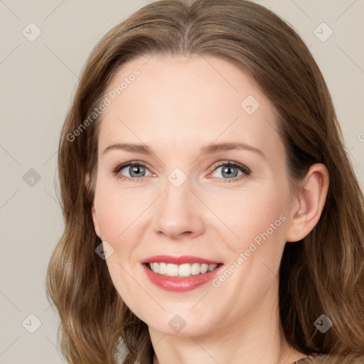 Joyful white young-adult female with medium  brown hair and green eyes