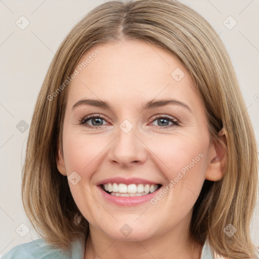 Joyful white young-adult female with medium  brown hair and green eyes