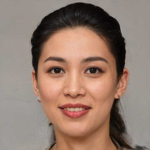 Joyful white young-adult female with medium  brown hair and brown eyes