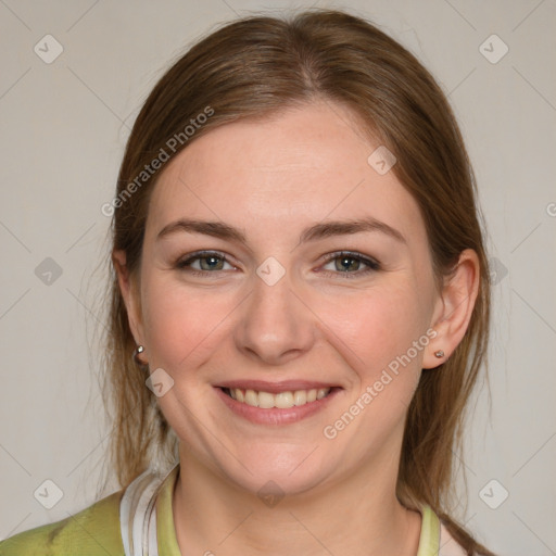 Joyful white young-adult female with medium  brown hair and grey eyes