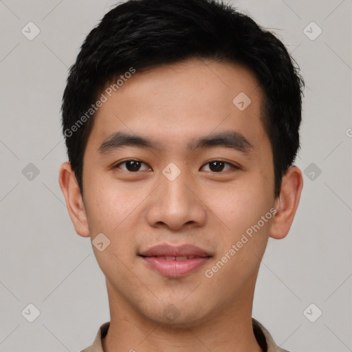 Joyful asian young-adult male with short  black hair and brown eyes