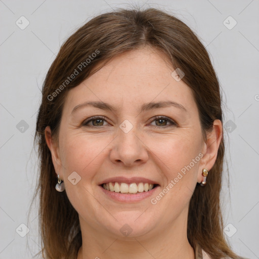 Joyful white adult female with long  brown hair and grey eyes