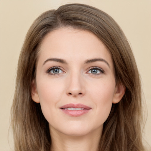 Joyful white young-adult female with long  brown hair and grey eyes