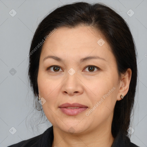 Joyful white adult female with medium  brown hair and brown eyes