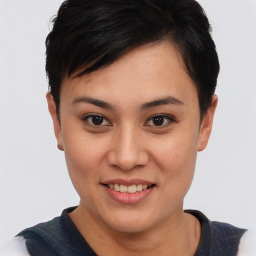 Joyful asian young-adult female with short  brown hair and brown eyes