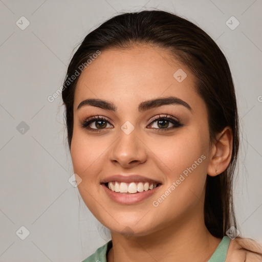 Joyful white young-adult female with long  brown hair and brown eyes