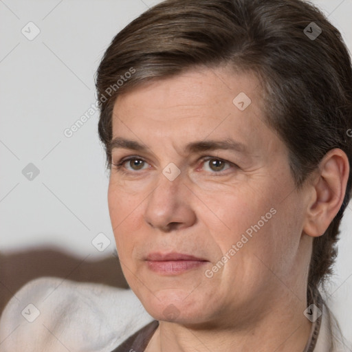 Joyful white adult female with short  brown hair and brown eyes