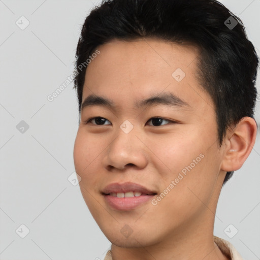 Joyful asian young-adult male with short  black hair and brown eyes