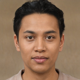 Joyful asian young-adult male with short  black hair and brown eyes