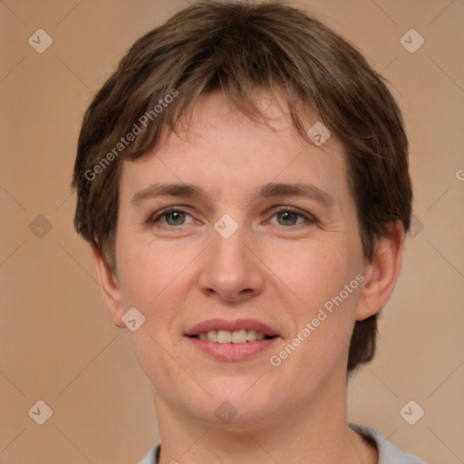 Joyful white young-adult female with short  brown hair and grey eyes