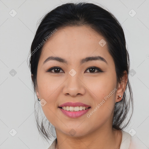 Joyful asian young-adult female with medium  brown hair and brown eyes