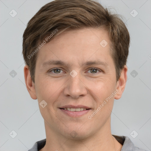 Joyful white adult male with short  brown hair and grey eyes