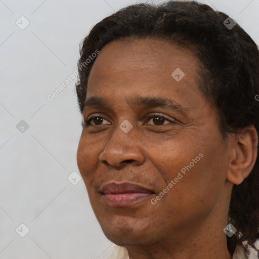 Joyful black adult male with short  black hair and brown eyes