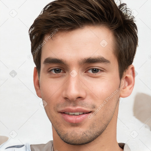 Joyful white young-adult male with short  brown hair and brown eyes