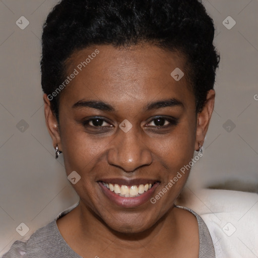 Joyful black young-adult female with short  brown hair and brown eyes