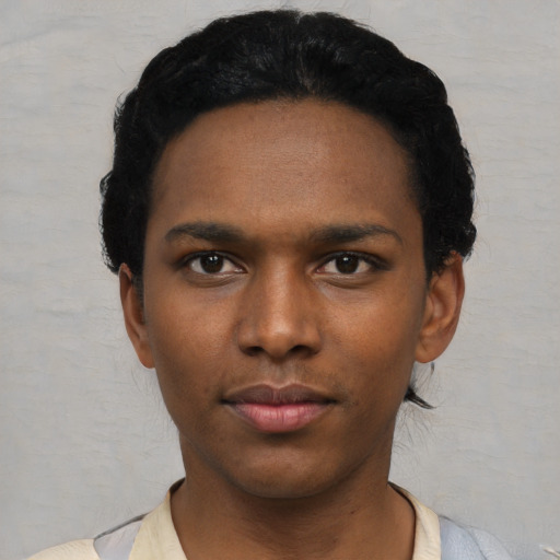 Neutral black young-adult male with short  black hair and brown eyes