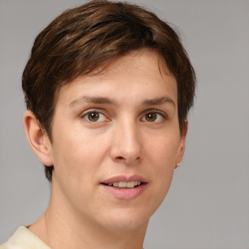 Joyful white young-adult female with short  brown hair and grey eyes