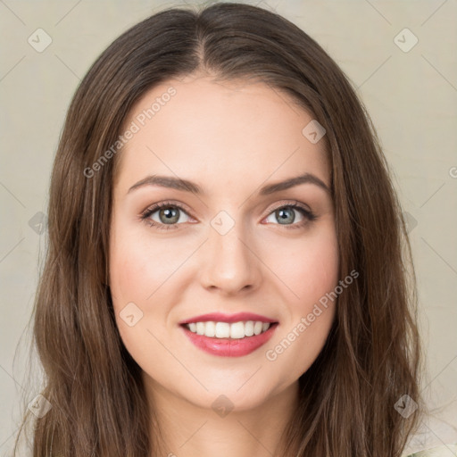 Joyful white young-adult female with long  brown hair and green eyes